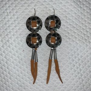 Leslie Crow Leather conch earrings
